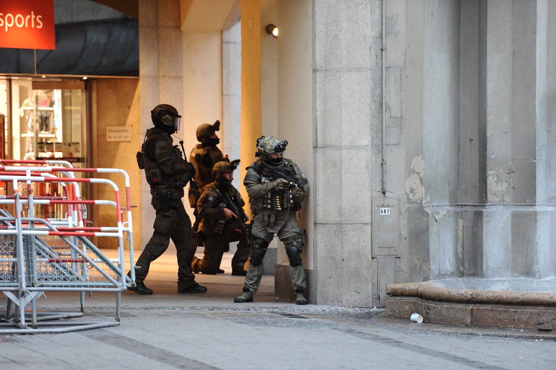 Heavily armed police forces operate at Karlsplatz (Stachus) square after a shooting in the Olympia shopping centre was reported in Munich, southern Germany, Friday, July 22, 2016. (Andreas Gebert/dpa via AP)