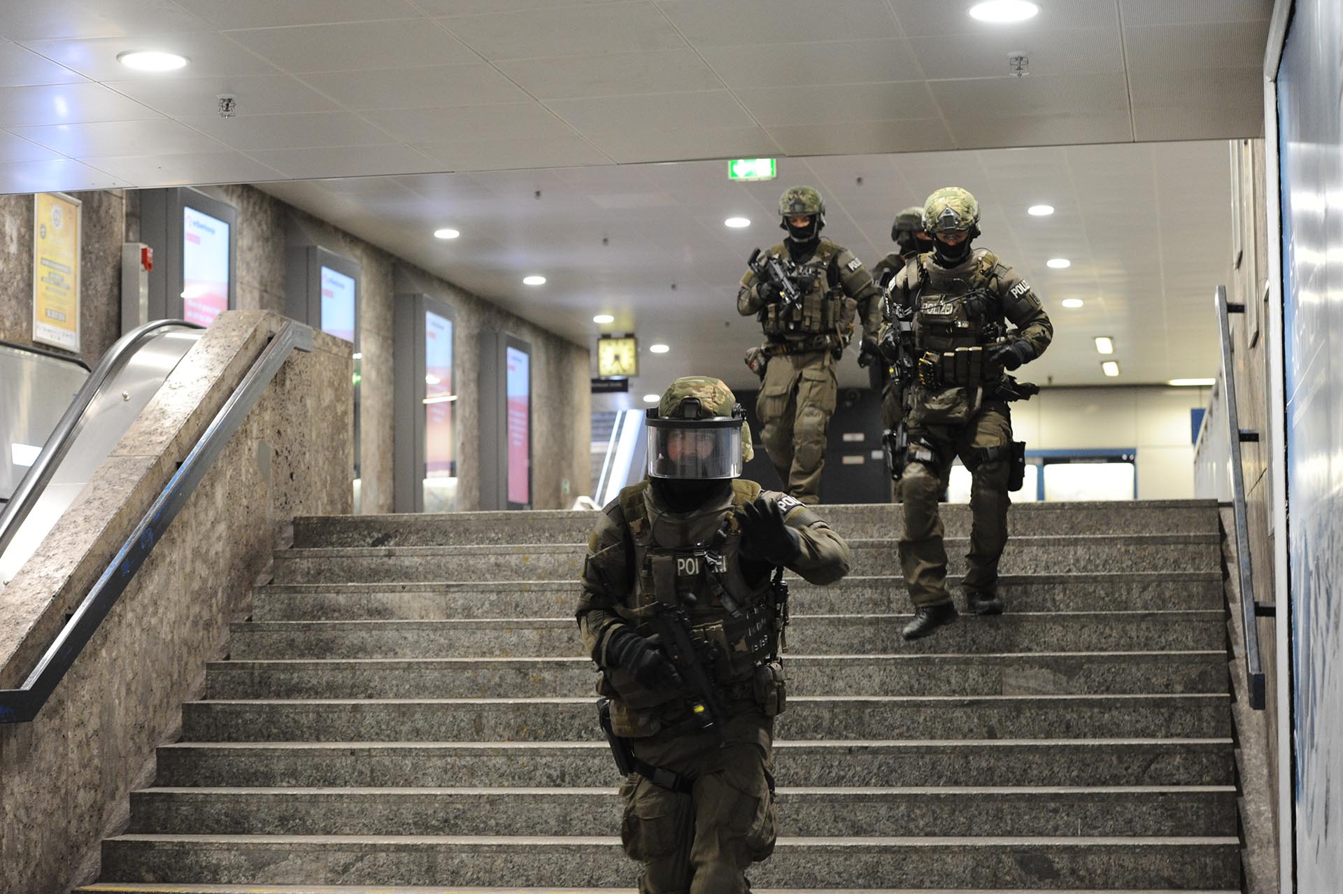Heavily armed police forces walk through the underground station Karlsplatz (Stachus) after a shooting in the Olympia shopping centre was reported in Munich, southern Germany, Friday, July 22, 2016. (Andreas Gebert/dpa via AP)
