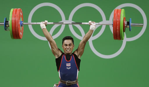 Sinphet Kruaithong, of Thailand, competes in the men's 56kg weightlifting competition at the 2016 Summer Olympics in Rio de Janeiro, Brazil, Sunday, Aug. 7, 2016. (AP Photo/Mike Groll)